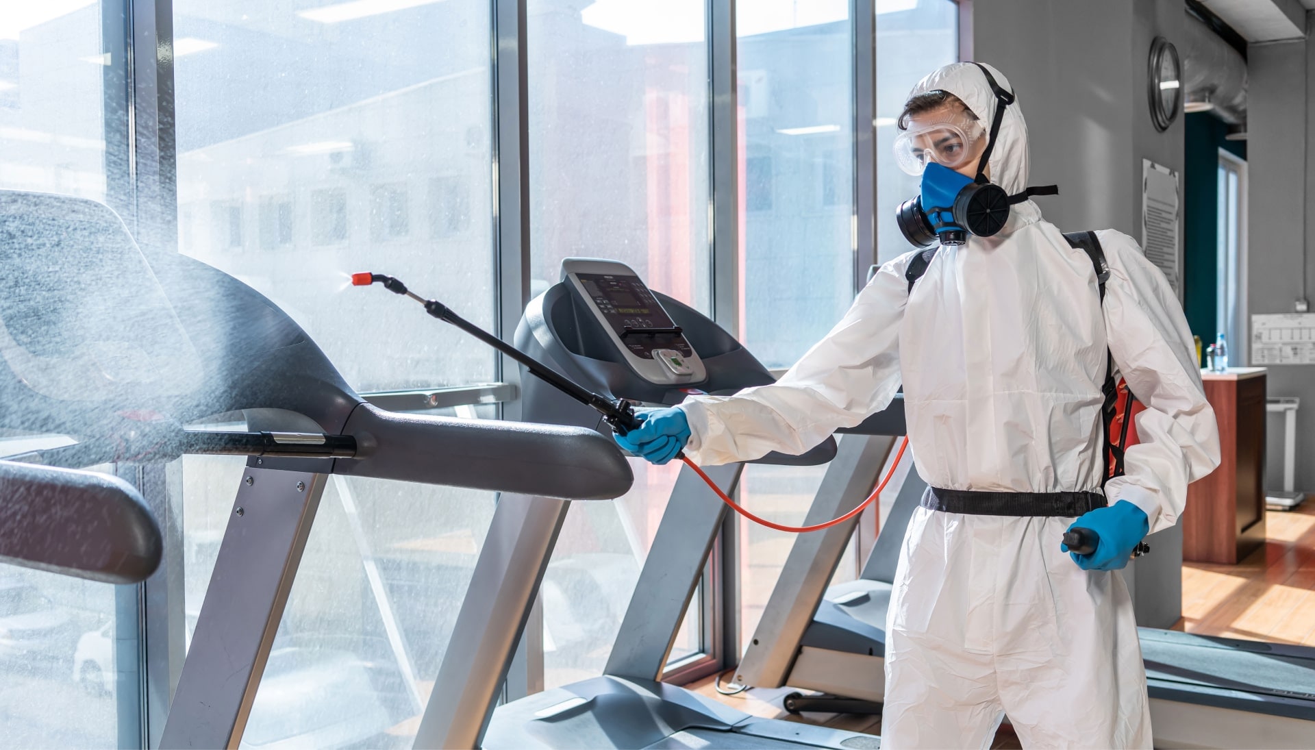 Commercial mold removal technician in gym.